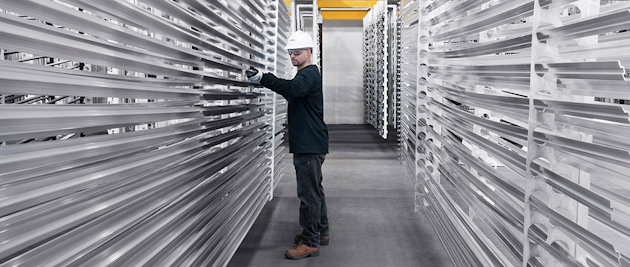 man racking extruded aluminum
