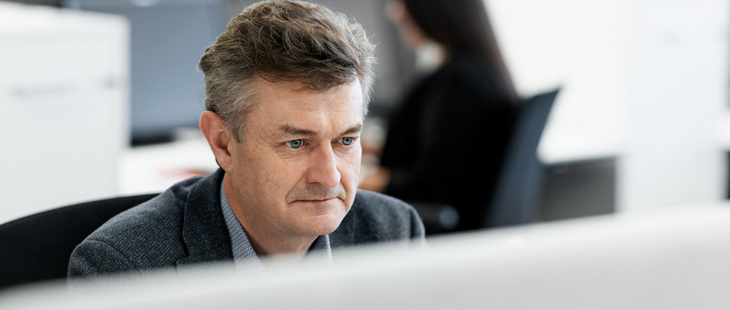 a man sitting at a desk