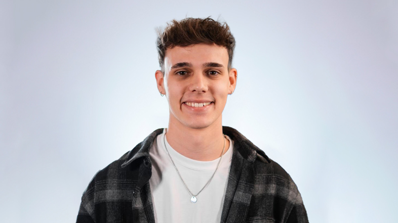 a man smiling at the camera