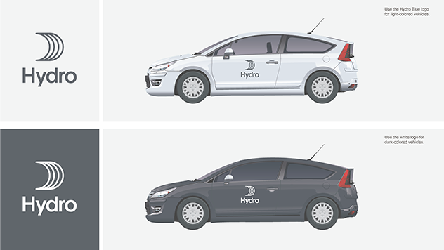 white car with blue logo on front door, black car with white logo same