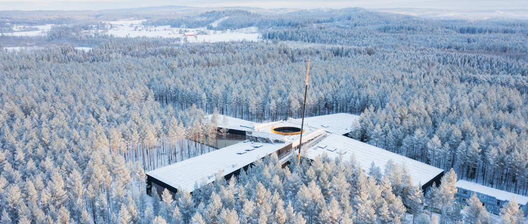 a building surrounded by snow