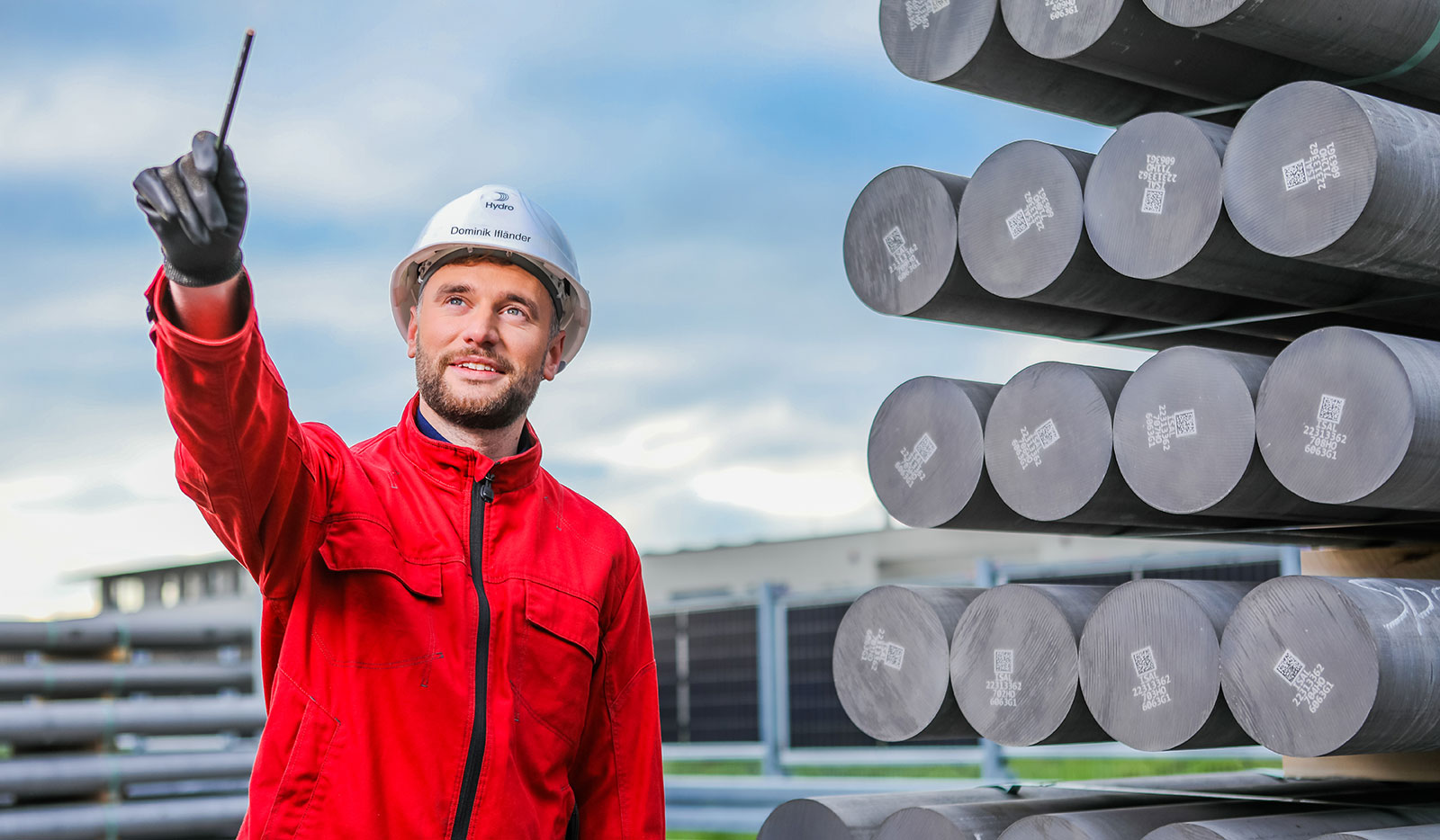 a man standing next to aluminium