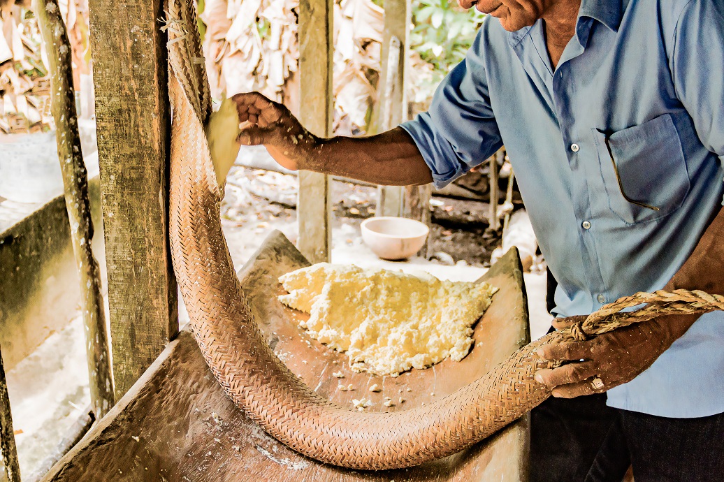 a man holding a large snake