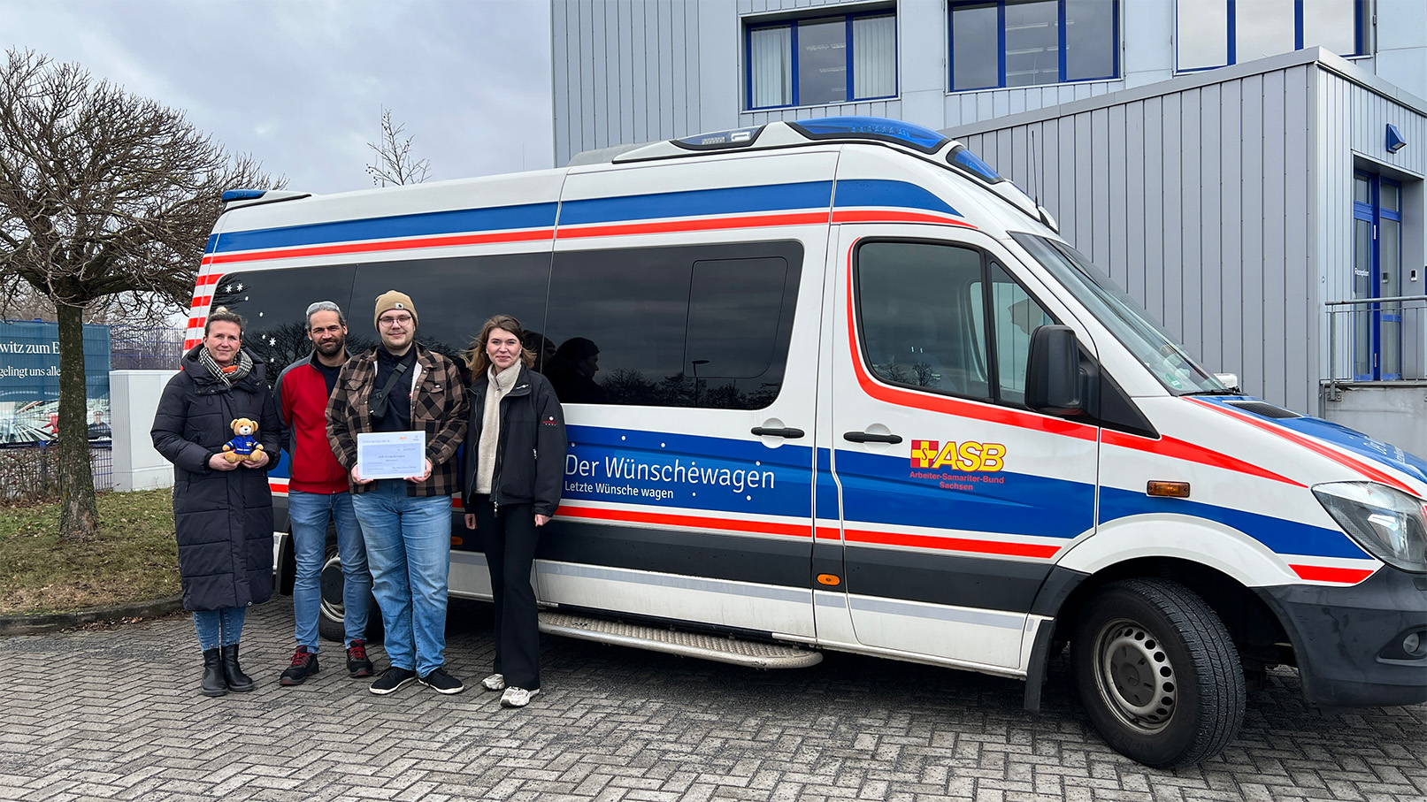 a group of people standing next to a van