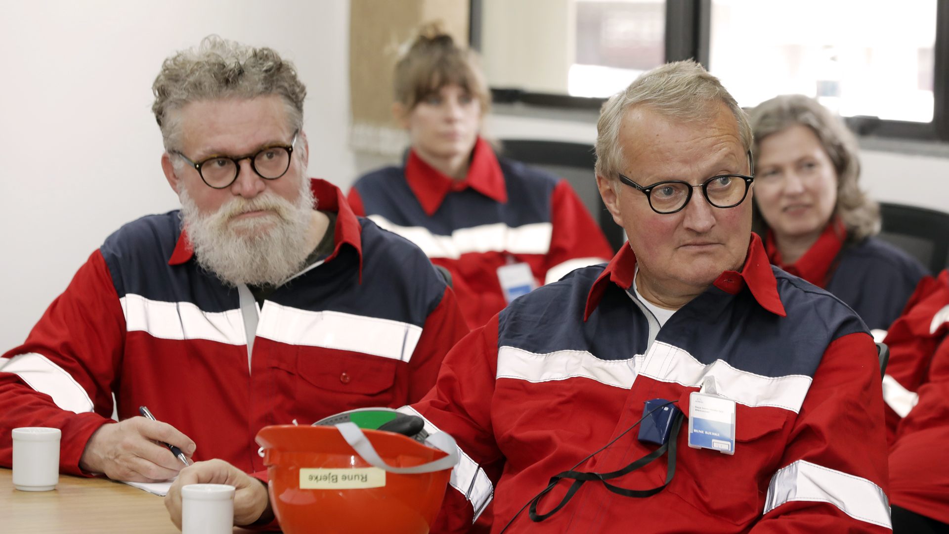 a group of people sitting at a table
