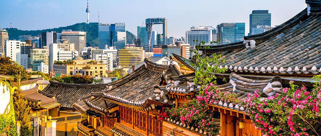 old style buildings with modern skyline in background