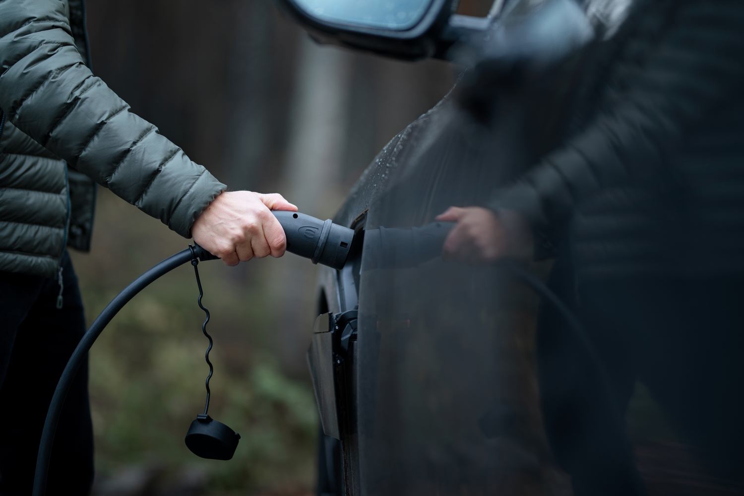 Plugging a charger in an electric car