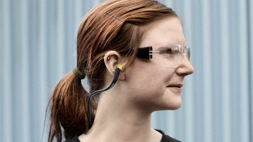 Woman with safety glasses and ear protection
