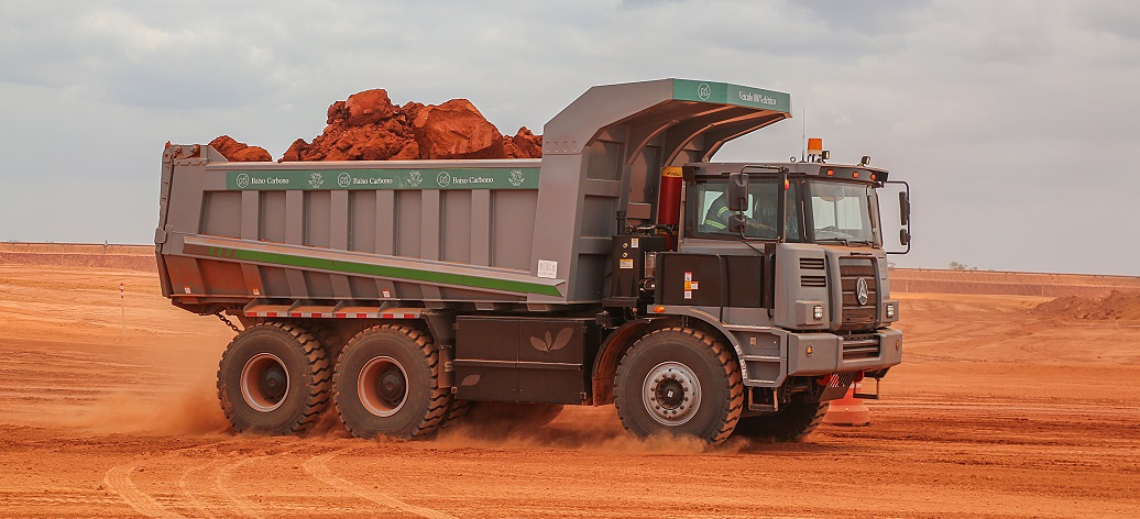 a military truck driving through a desert
