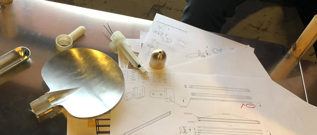 Aluminium table with technical drawings