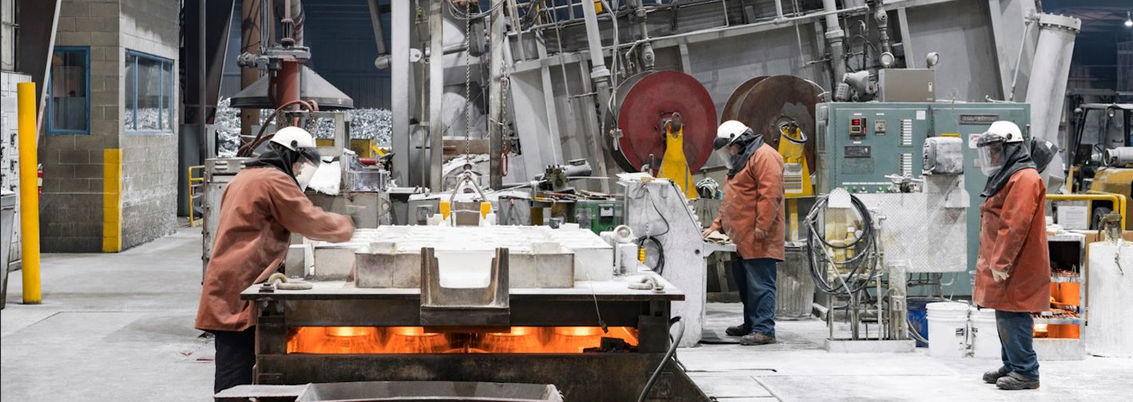 a group of men working on a machine