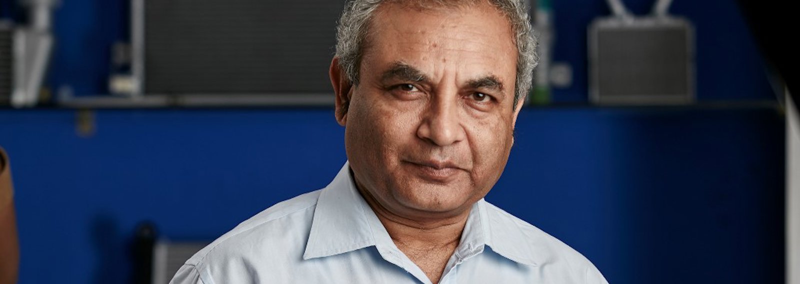 Ravi Chidambar holding a heat exchanger