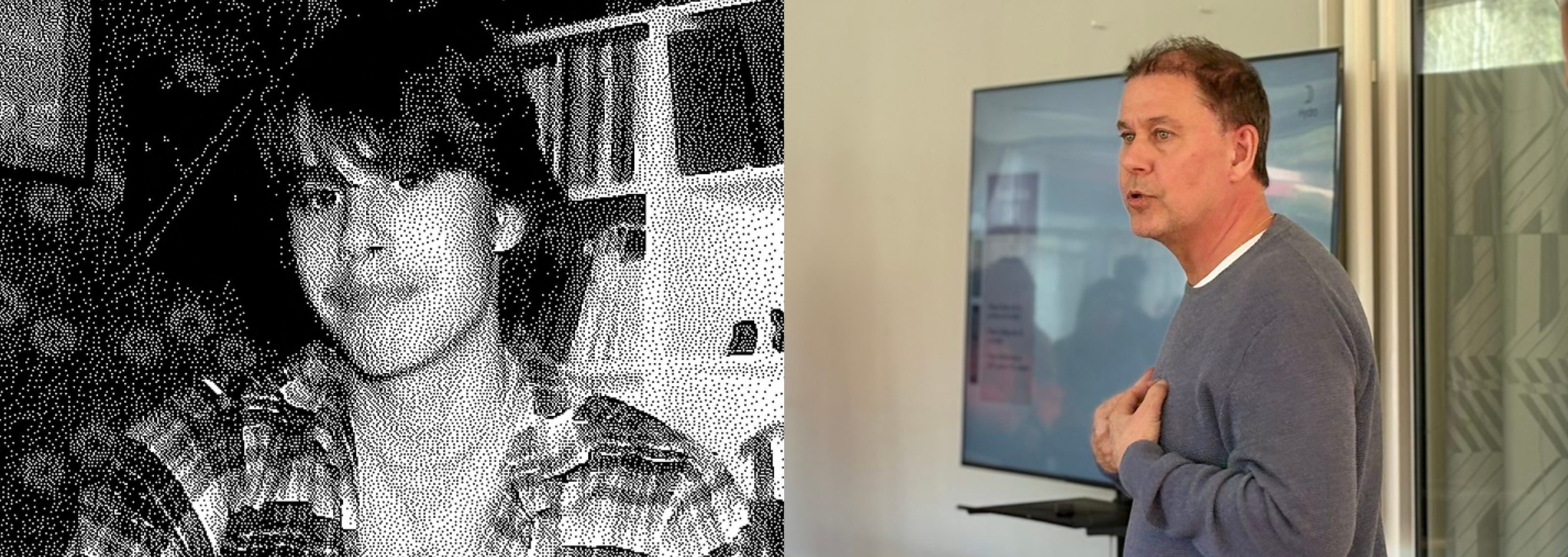 a man standing in front of a poster