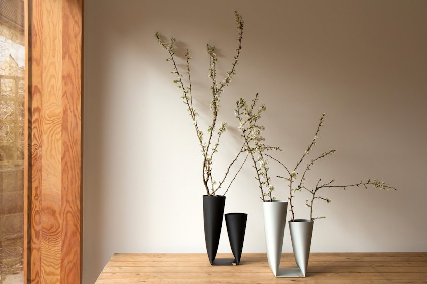 black and white vases on a table